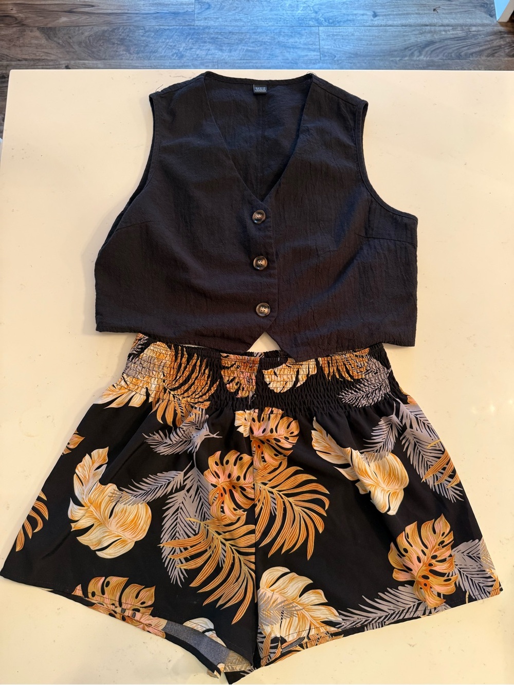 Black Button-Front Vest with Black Tropical Print Shorts